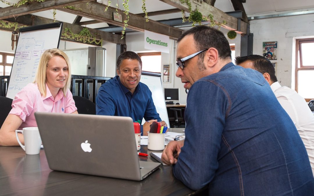 customer experience team looking at a computer