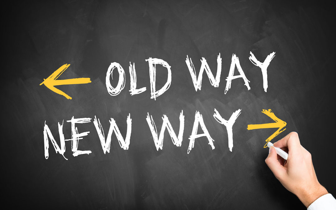 Phrase "old way" and "new way" written on chalkboard