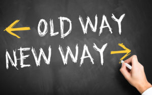 Phrase "old way" and "new way" written on chalkboard